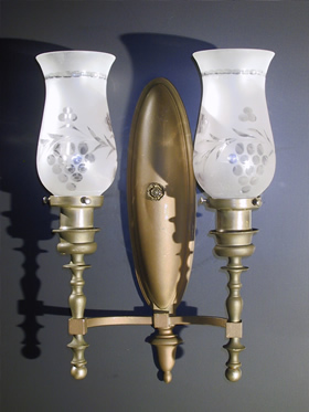 A Pair of double-arm Bradley and Hubbard  Large Oval Back Sconces